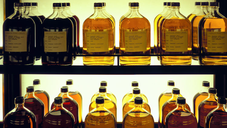 bottles on display at suntory yamazaki whisky library